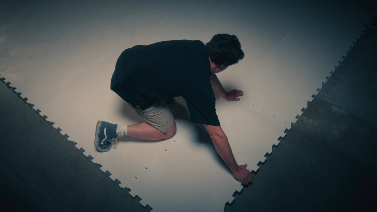 Overhead view of a person laying ArcticGlide Pro panels edge to edge