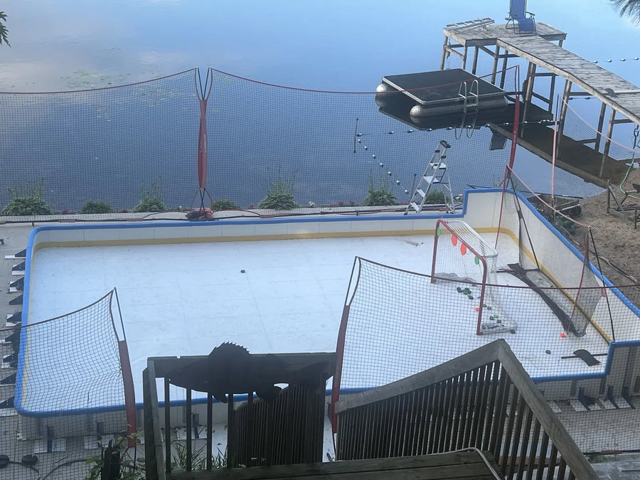 An outdoor ArcticGlide installation with boards and nets beside a lake