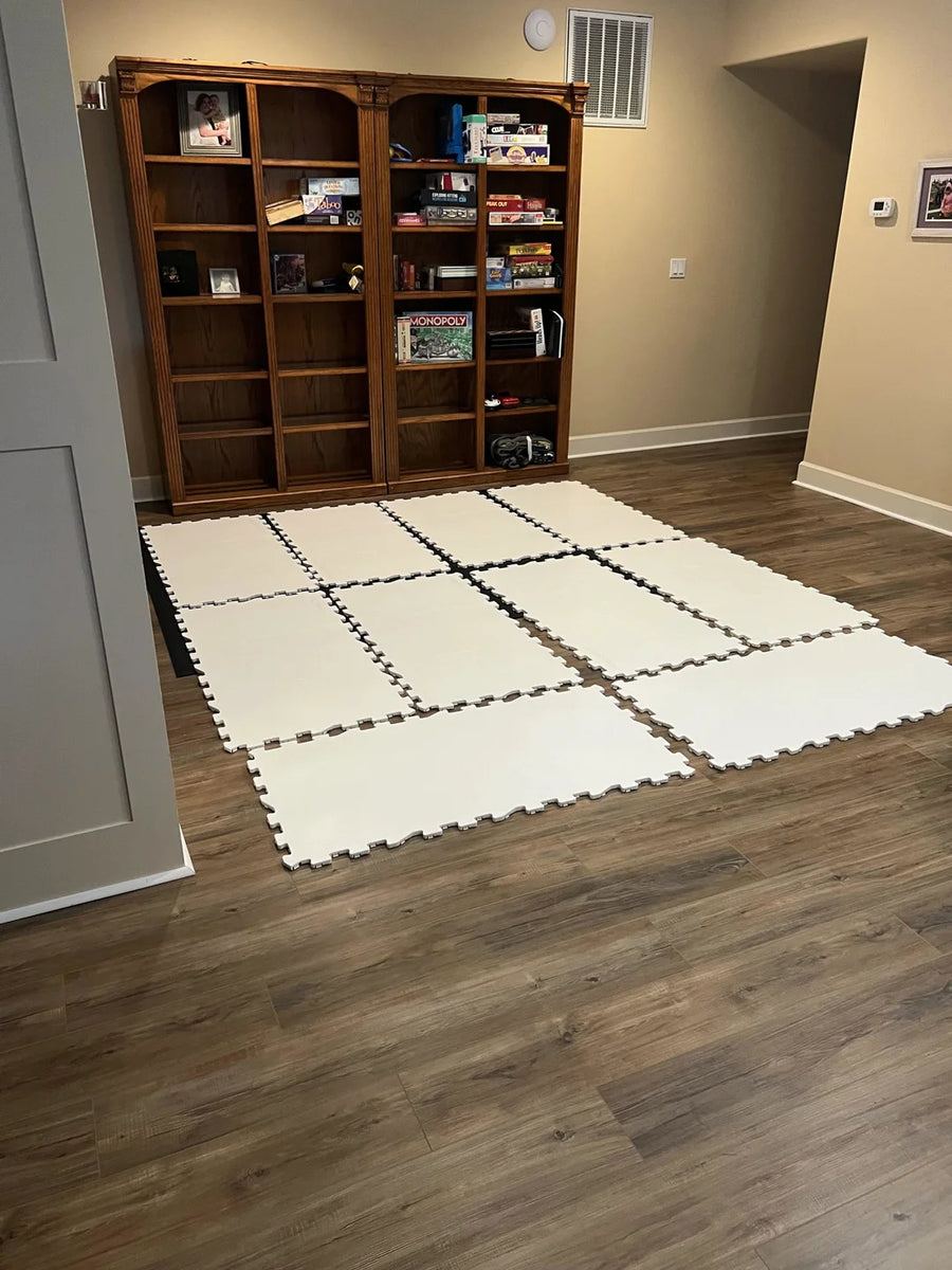 Eight ArcticGlide Pro panels laid in a basement room