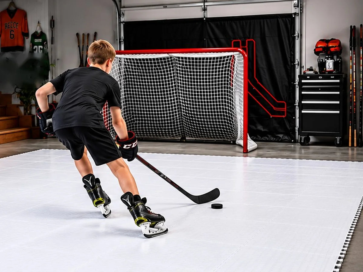 Young player skating with a puck on Potent ice tiles in a home garage