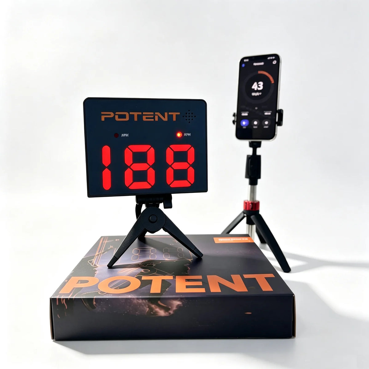 Speed Radar Gun 2.0 on its mini tripod beside a phone showing the Myspeedz app, with the Potent box